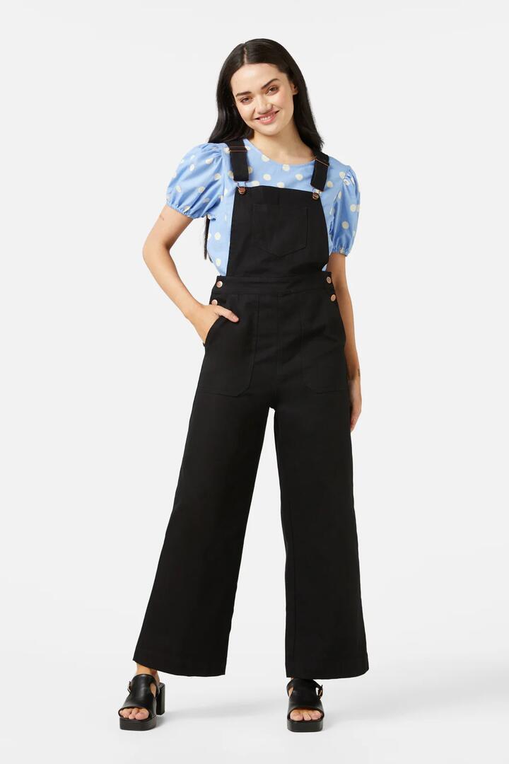Image of a model wearing Pants. Productname: Carey Overall in Black colour by brand - Princess Highway