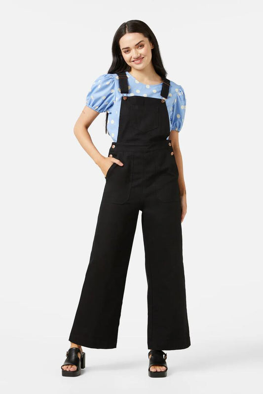 Image of a model wearing Pants. Productname: Carey Overall in Black colour by brand - Princess Highway