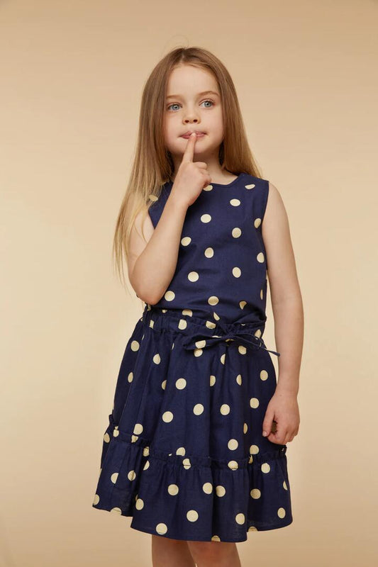 Image of a model wearing Skirts. Productname: Primrose SpotTwirlySkirt in Navy colour by brand - Princess Highway Kids
