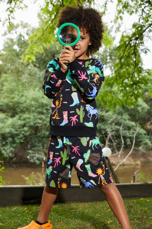 Image of a model wearing Shorts. Productname: Sandman Kids Shorts in Black colour by brand - Dangerkids