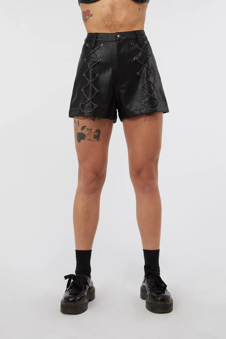 Image of a model wearing Shorts. Productname: Chain Lace Up PU Short in Black colour by brand - Dangerfield