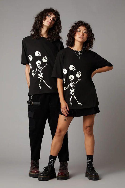 Image of a model wearing Tops. Productname: Tumbling Act Tee in Black colour by brand - Black Friday