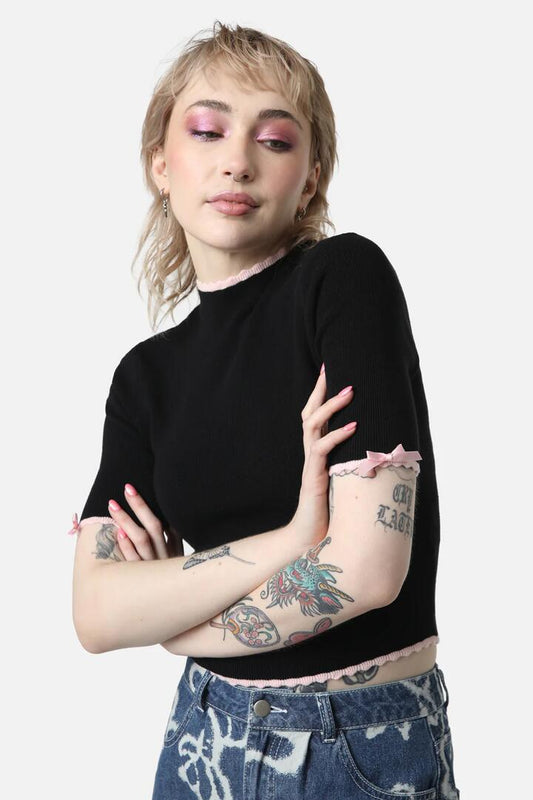 Image of a model wearing Tops. Productname: Ammabelle Knit Bow Top in Black colour by brand - Dangerfield
