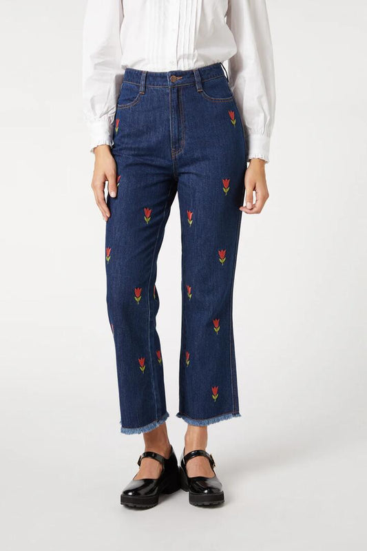 Image of a model wearing Denim. Productname: Tulip Embroidered Jean in Mid Denim colour by brand - Princess Highway