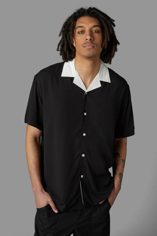 Image of a model wearing Shorts. Productname: Contrast Collar Short Sleeve Shirt in Black colour by brand - Black Friday