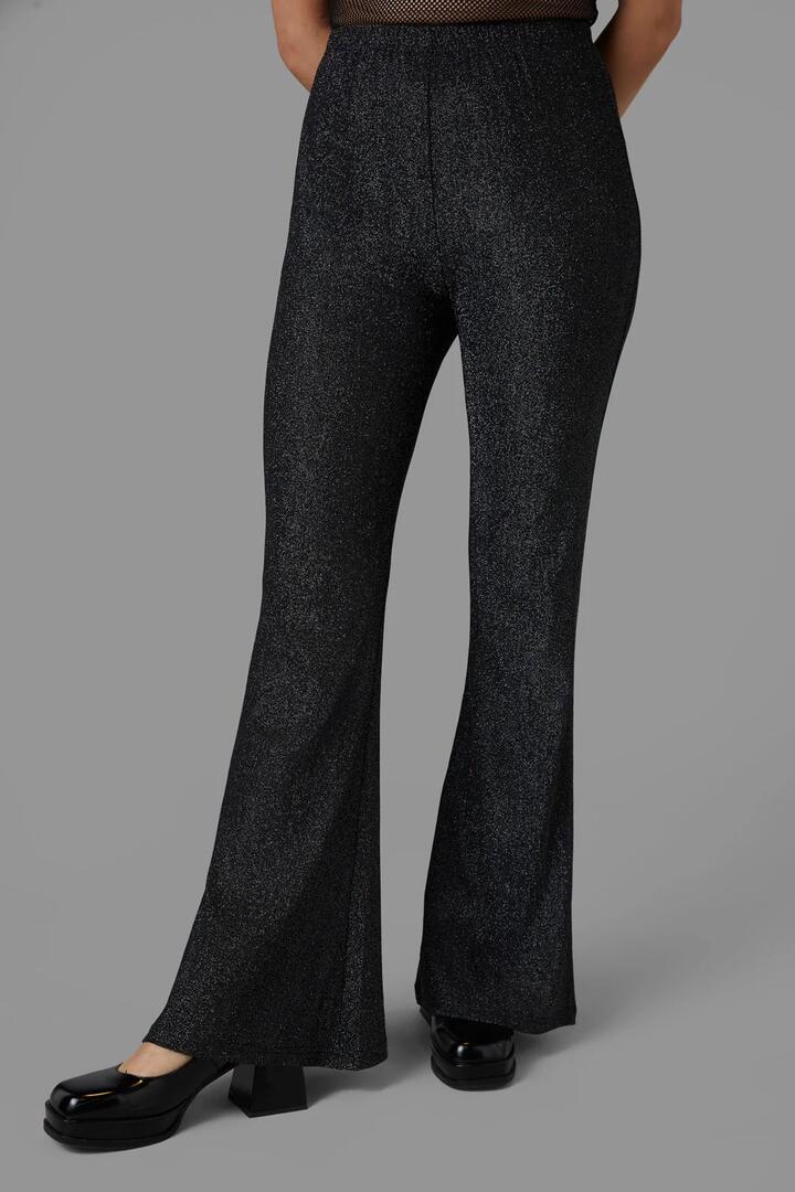 Image of a model wearing Pants. Productname: Solstice Pant in Black colour by brand - Black Friday