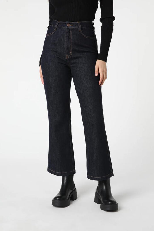 Image of a model wearing Denim. Productname: Ava Flick Jean in Dark Denim colour by brand - Princess Highway
