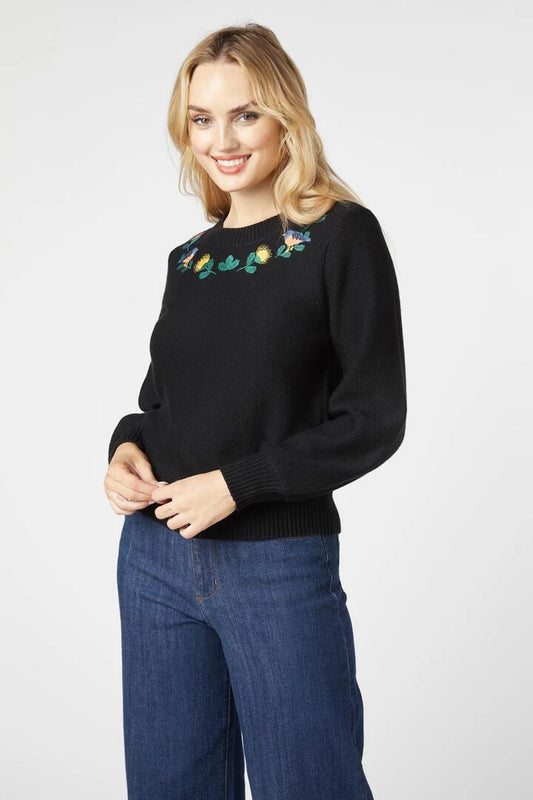 Image of a model wearing Outerwear. Productname: Protea Embroidered Jumper in Black colour by brand - Princess Highway