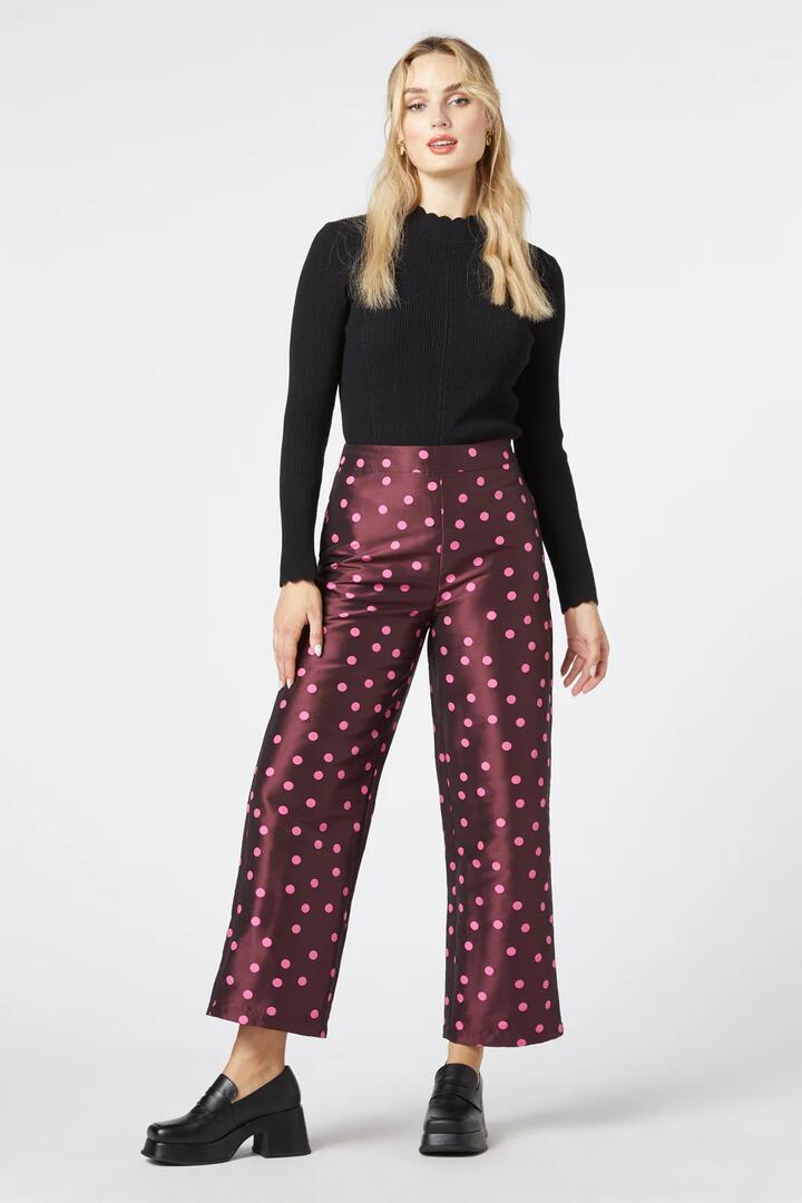 Image of a model wearing Pants. Productname: Bonnie Spot Pant in Berry colour by brand - Princess Highway