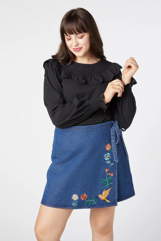 Image of a model wearing Skirts. Product name - Sweet Nectar Embroideredroid Skirt in Mid Denim colour by brand - Princess Highway