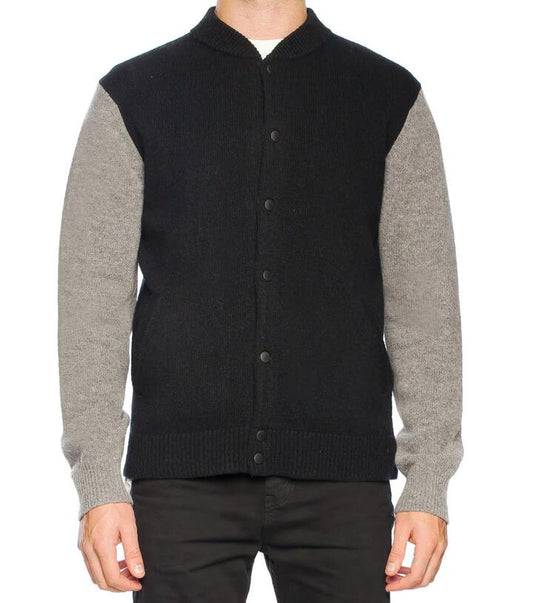 Image of a model wearing Outerwear. Productname: Bomber Knit in Black colour by brand - Revival