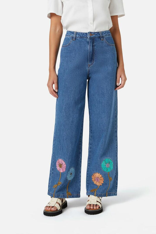 Image of a model wearing Denim. Productname: Fresh Blooms Emb Jean in Mid Denim colour by brand - Princess Highway
