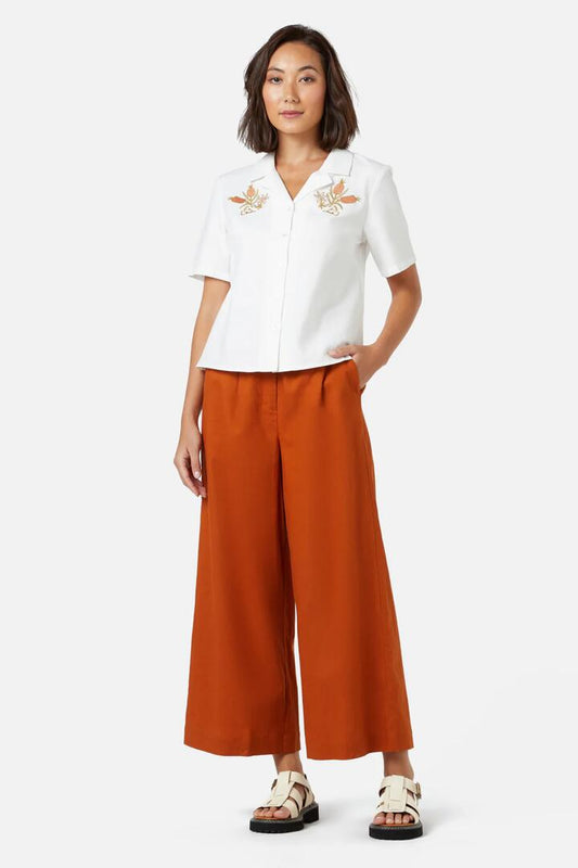 Image of a model wearing Tops. Productname: Enid Emb Shirt in Cream colour by brand - Princess Highway