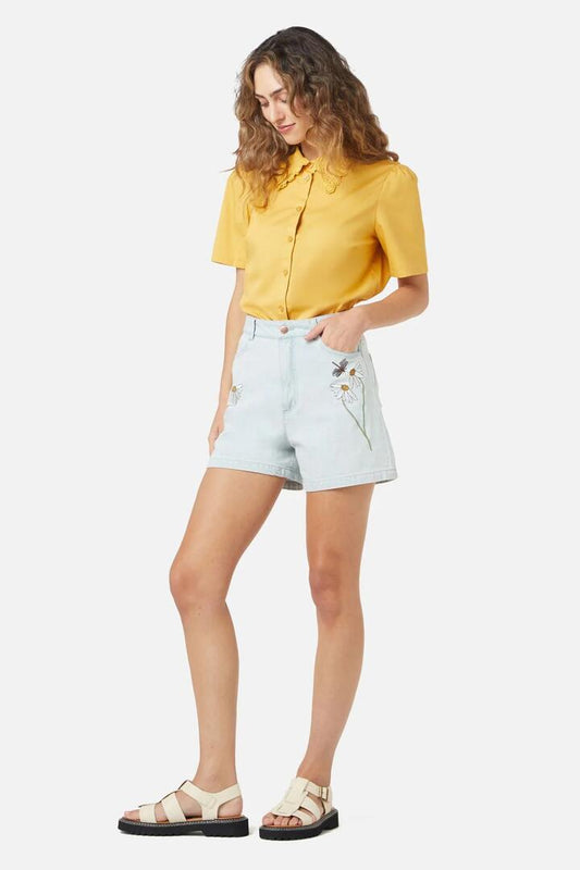 Image of a model wearing Shorts. Productname: Green Garden Emb Short in Light Denim colour by brand - Princess Highway