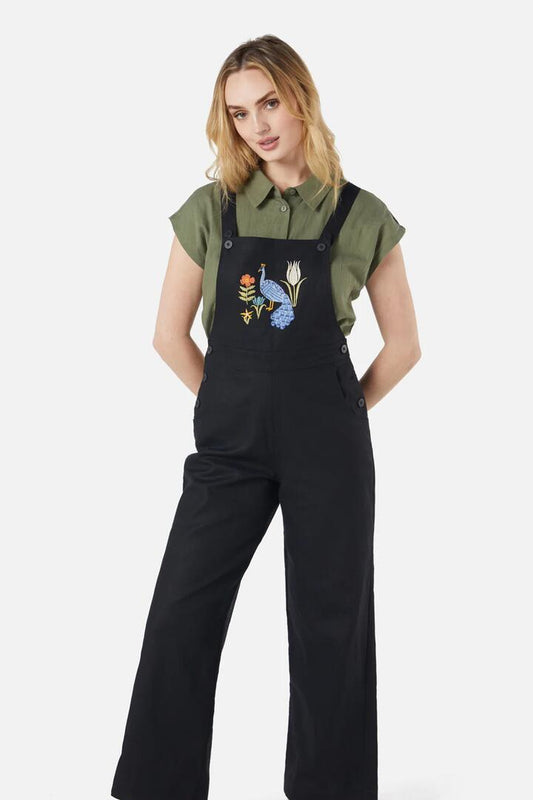 Image of a model wearing Pants. Productname: Peacock Emb Overalls in Black colour by brand - Princess Highway