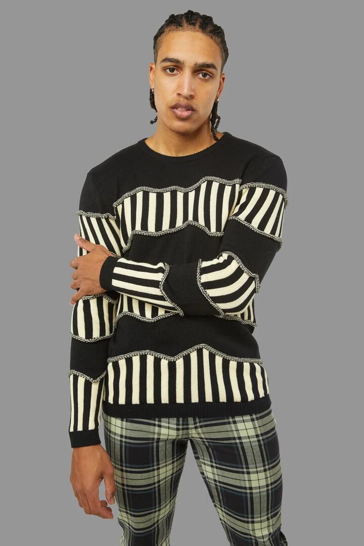 Image of a model wearing Tops. Productname: Caution Knit in White/Black colour by brand - Black Friday