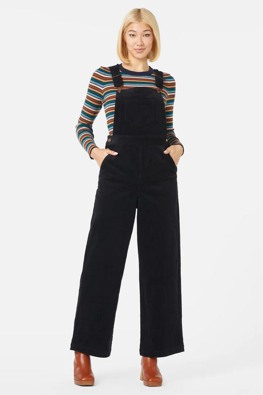 Image of a model wearing Pants. Productname: Casey Cord Overall in Black colour by brand - Princess Highway