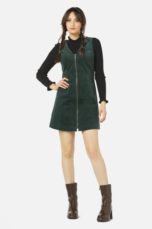Image of a model wearing Dress. Productname: Honey Cord Pinny in Deep Green colour by brand - Princess Highway