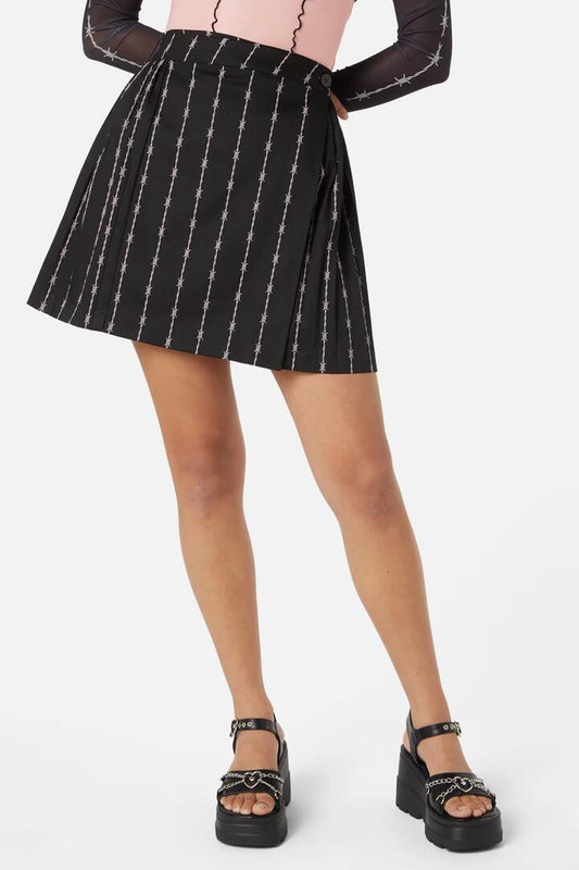 Image of a model wearing Skirts. Productname: Barbed Wire Pleated Slider Skirt in Black colour by brand - Dangerfield