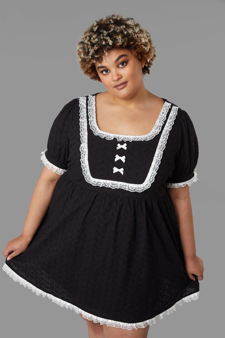 Image of a model wearing Dress. Productname: Curve Tululah Dress in Black colour by brand - Black Friday