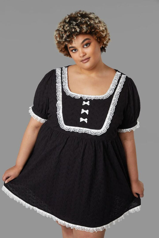 Image of a model wearing Dress. Productname: Curve Tululah Dress in Black colour by brand - Black Friday
