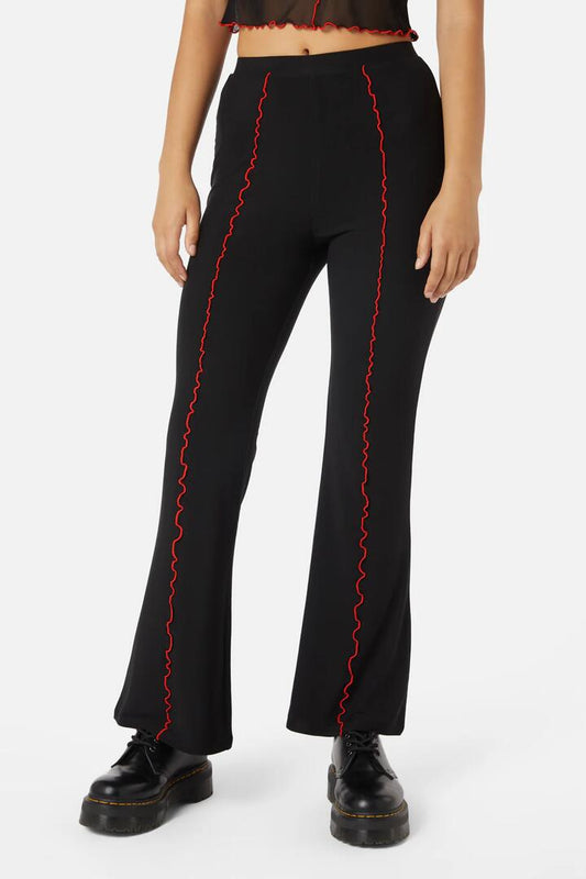 Image of a model wearing Pants. Productname: Manic Mesh Babylock Pants in Black/Red colour by brand - Dangerfield