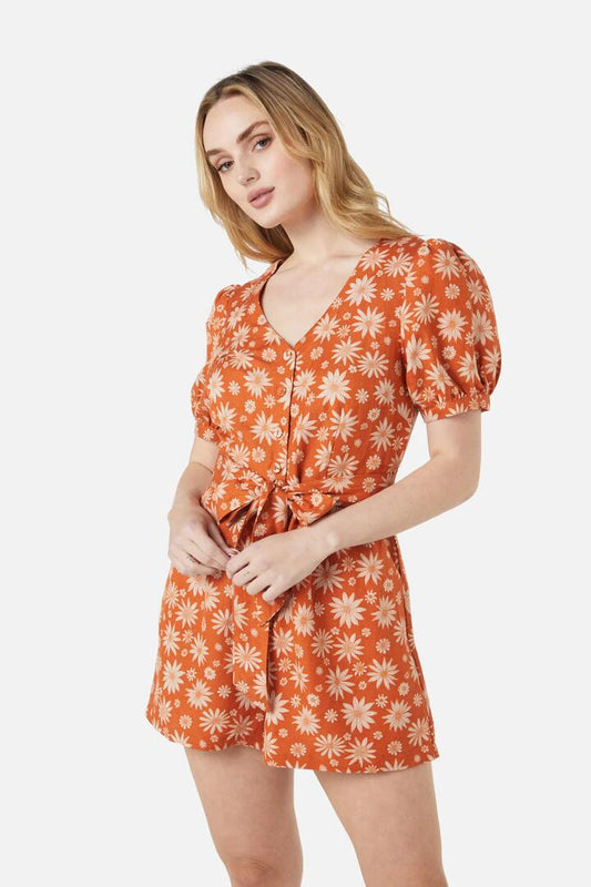 Image of a model wearing Dress. Productname: Bree Ditsy Playsuit in Orange colour by brand - Princess Highway