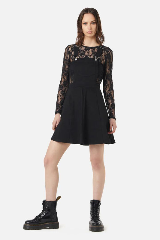 Image of a model wearing Dress. Productname: Unity Bib & Brace Pinafore in Black colour by brand - Dangerfield