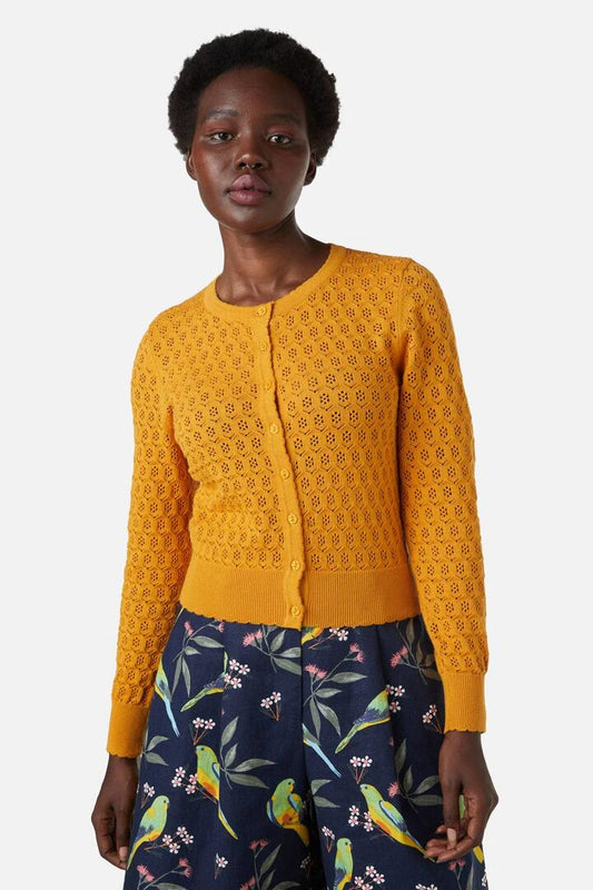Image of a model wearing Outerwear. Productname: Tamara Cardi in Mustard colour by brand - Princess Highway