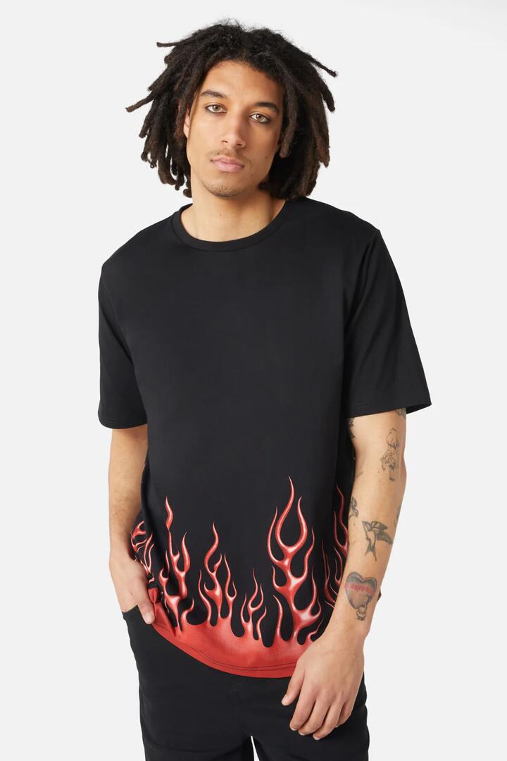 Image of a model wearing Tops. Productname: Naked Flame Tee in Black colour by brand - Dangerfield