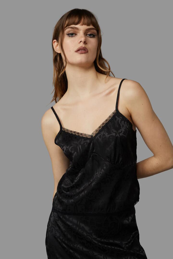 Image of a model wearing Tops. Productname: All Hallows Eve Top in Black colour by brand - Black Friday