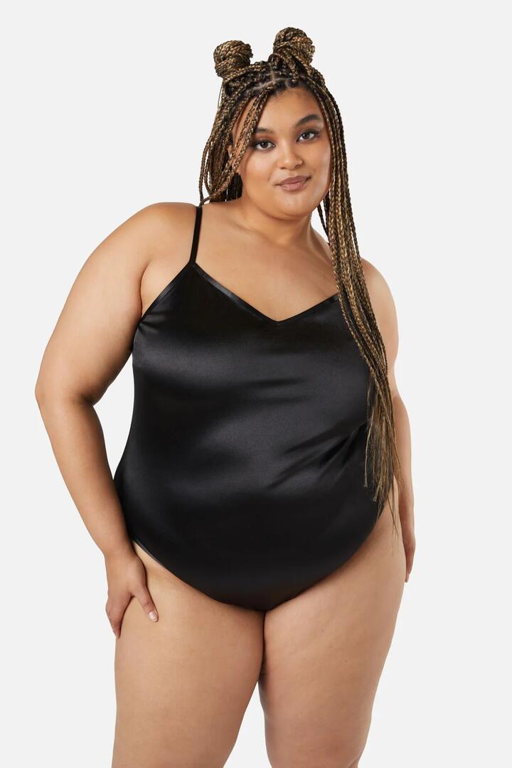 Image of a model wearing Tops. Productname: Curve Atomic Bodysuit in Black colour by brand - Dangerfield