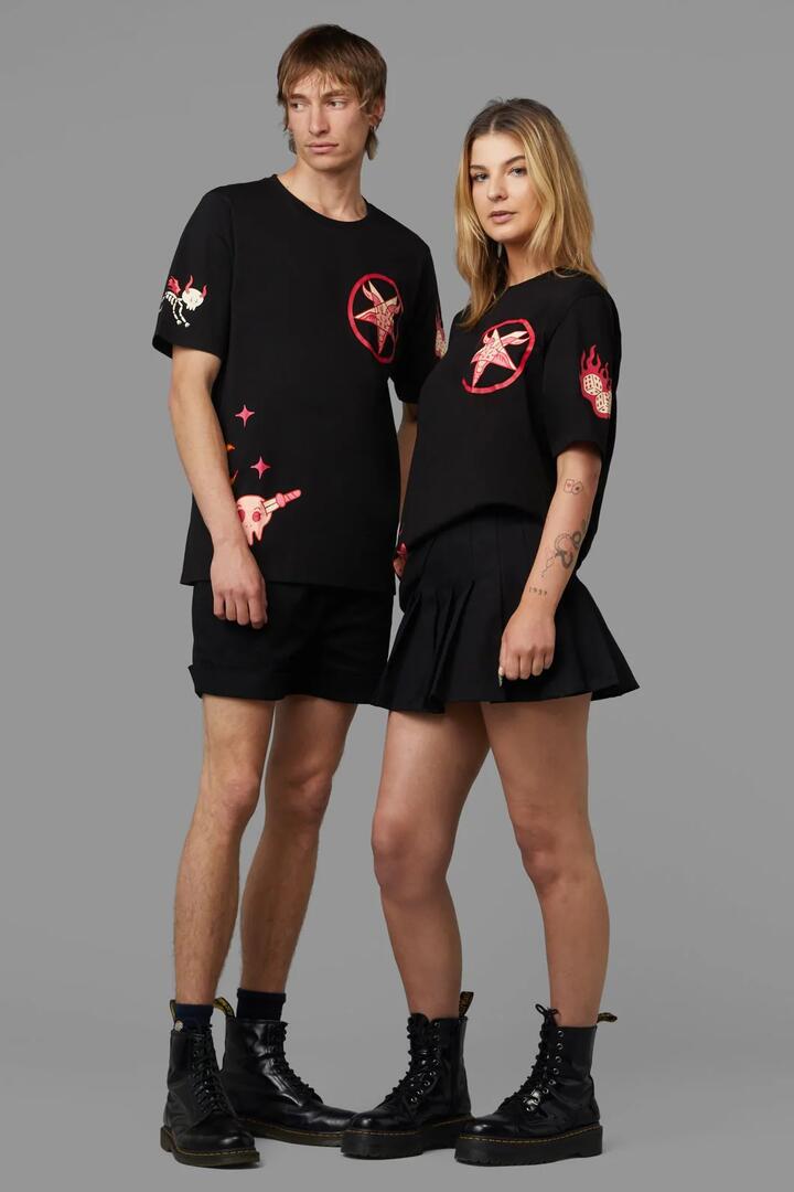 Image of a model wearing Tops. Productname: Back Stabber Tee in Black colour by brand - Black Friday