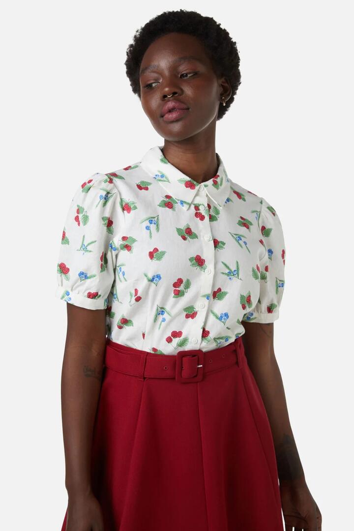 Image of a model wearing Tops. Productname: Berry Blouse in Cream colour by brand - Princess Highway