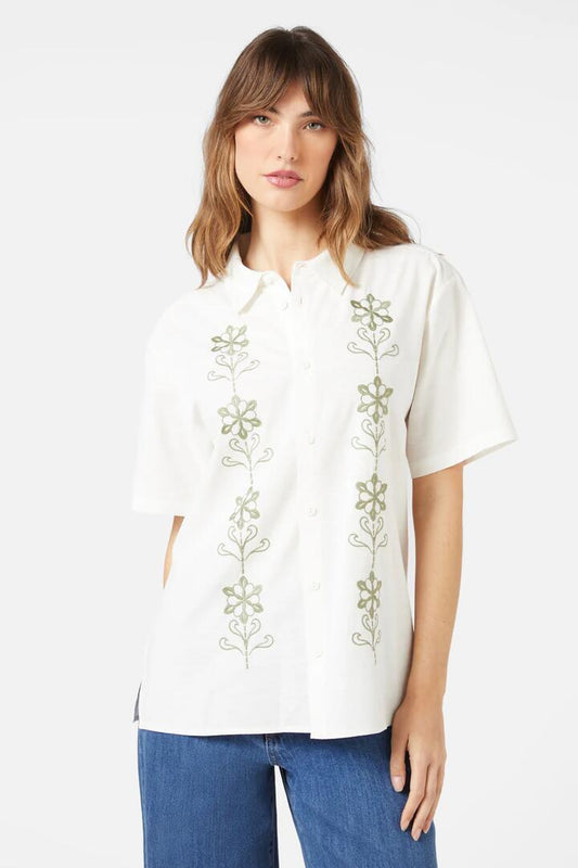 Image of a model wearing Tops. Productname: Retro Emb Everyone Shirt in Cream colour by brand - Princess Highway