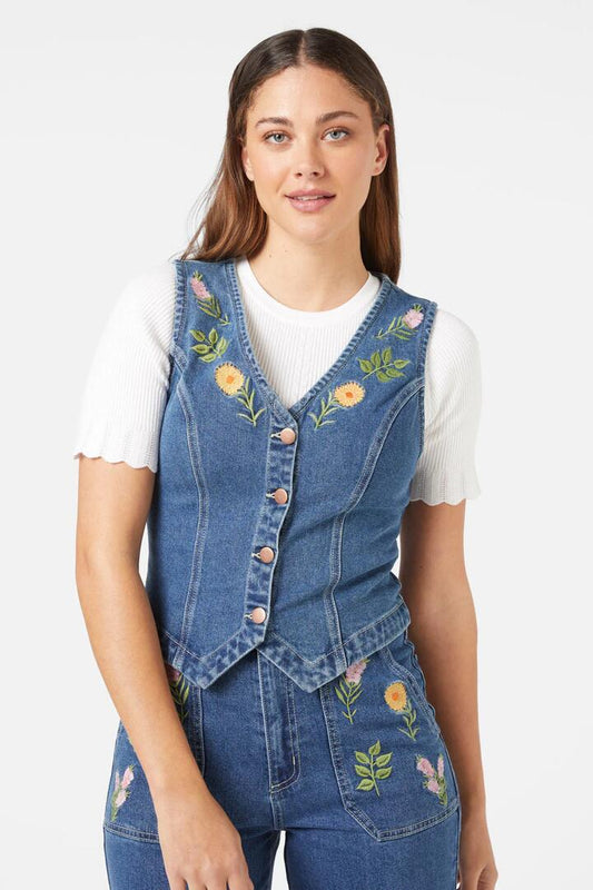Image of a model wearing Tops. Productname: Flower Mix Emb Vest in Mid Denim colour by brand - Princess Highway