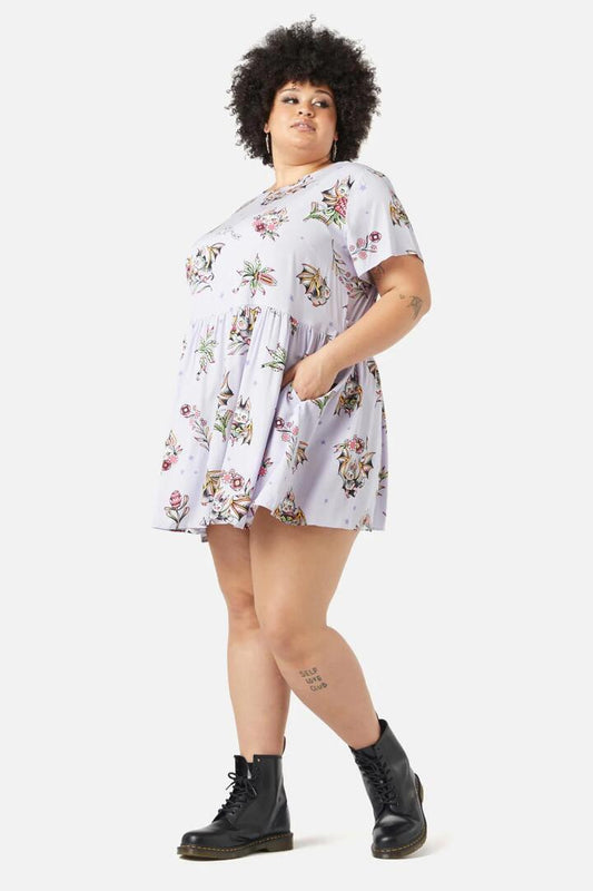 Image of a model wearing Dress. Productname: Curve Fruity Bats Dress in Lilac colour by brand - Black Friday