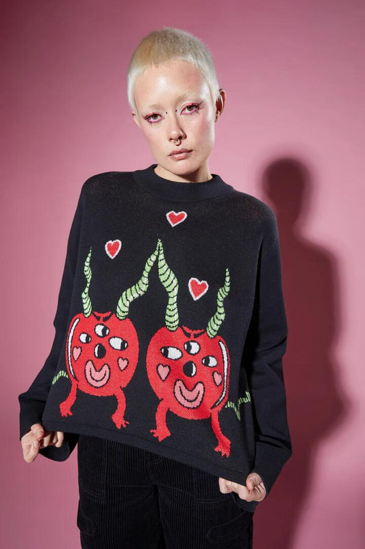 Image of a model wearing Tops. Productname: Cherry Poppin' Skivvy in Black colour by brand - Black Friday