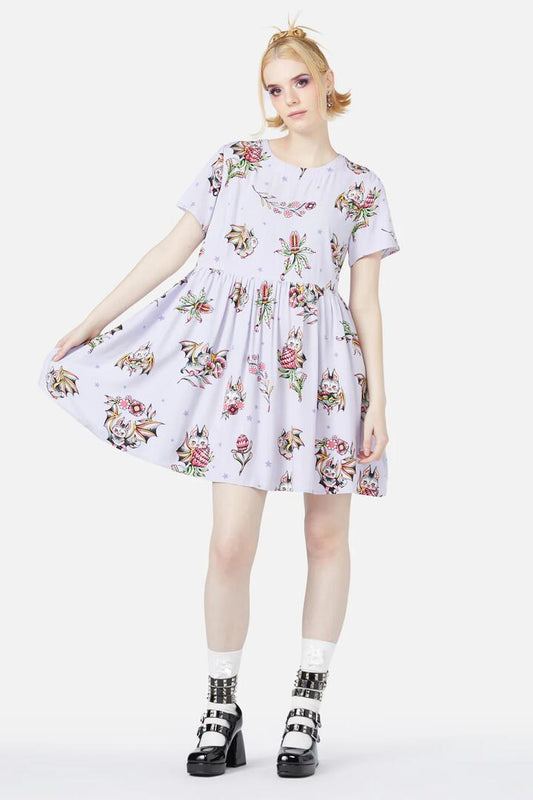 Image of a model wearing Dress. Productname: Fruity Bats Dress in Lilac colour by brand - Black Friday