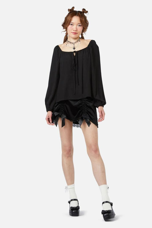 Image of a model wearing Tops. Productname: Keep Sake Billow Blouse in White colour by brand - Dangerfield