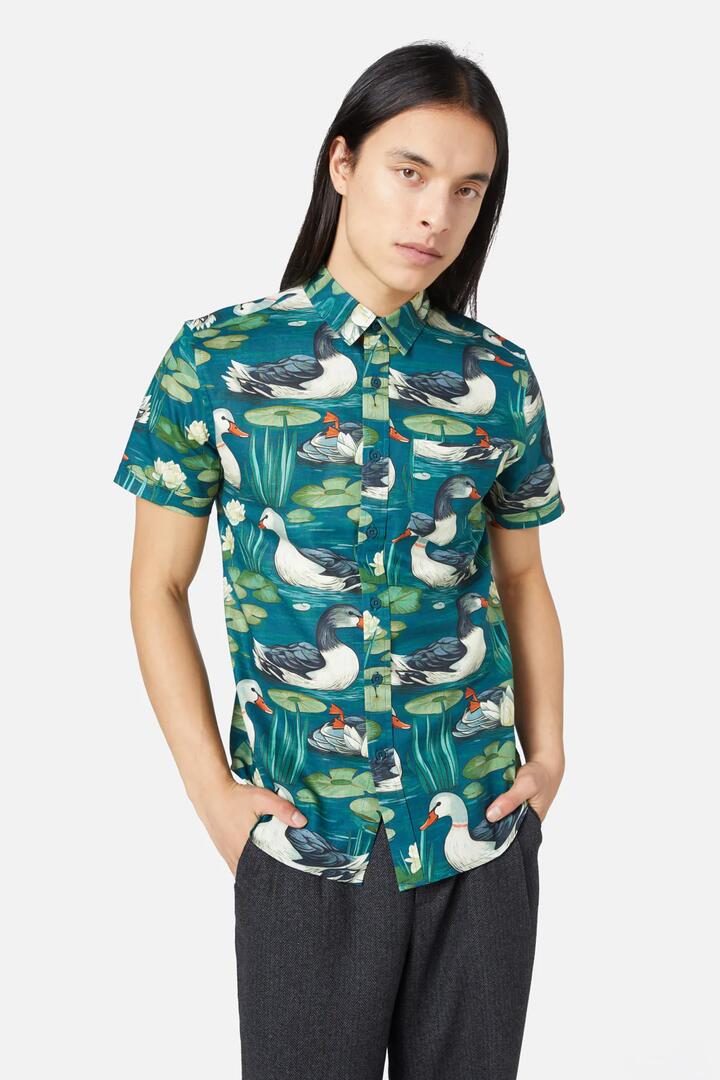 Image of a model wearing Tops. Productname: Duck To Water SS Shirt in Blue colour by brand - Dangerfield