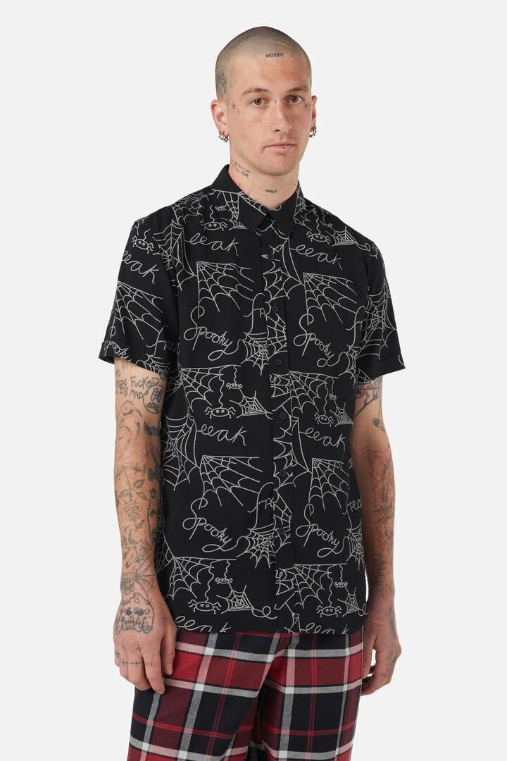 Image of a model wearing Tops. Productname: Entangled Printed SS Shirt in Black colour by brand - Black Friday