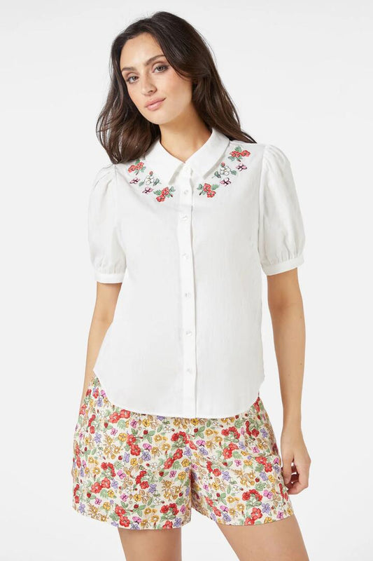 Image of a model wearing Tops. Productname: Papillon Emb Blouse in Cream colour by brand - Princess Highway