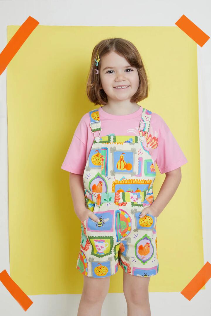 Image of a model wearing Pants. Productname: Cottage Kids Overalls in Cream colour by brand - Princess Highway Kids
