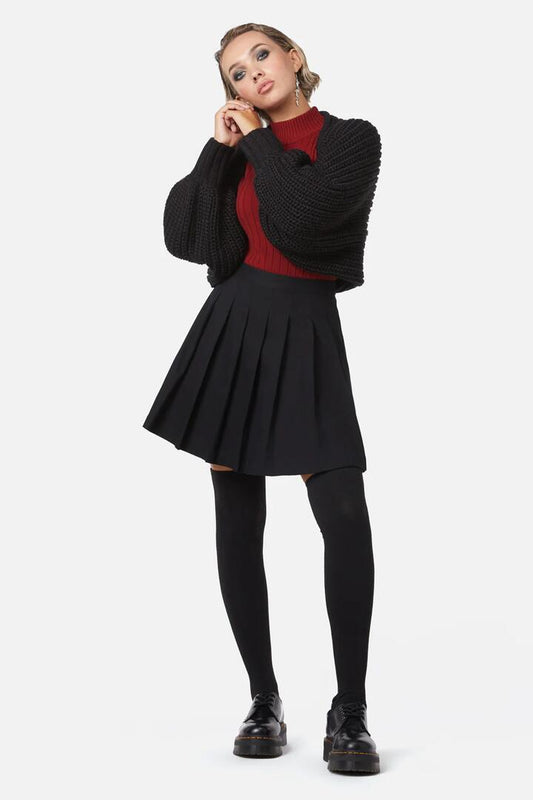 Image of a model wearing Skirts. Productname: Grave Respect Pleated Skirt in Black colour by brand - Dangerfield