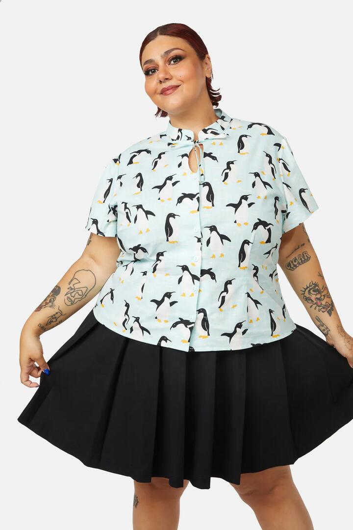 Image of a model wearing Tops. Productname: Curve Penguin Blouse in Blue colour by brand - Dangerfield