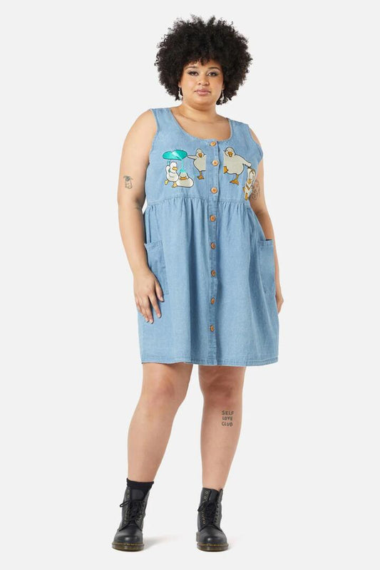 Image of a model wearing Dress. Productname: Curve Splish Splash Pinafore in Blue colour by brand - Dangerfield