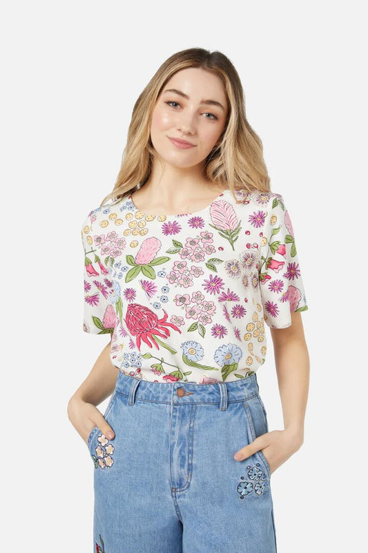 Image of a model wearing Tops. Productname: Bouquet Top in Cream colour by brand - Princess Highway