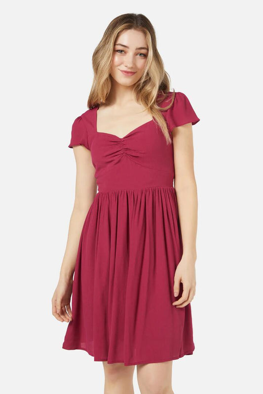 Image of a model wearing Dress. Productname: Poet Mini Dress in Berry colour by brand - Princess Highway