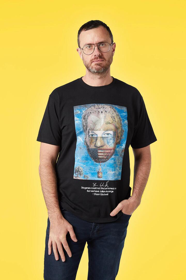 Image of a model wearing Tops. Productname: Shaun Gladwell's Assange in Black colour by brand - Pulp Kitchen